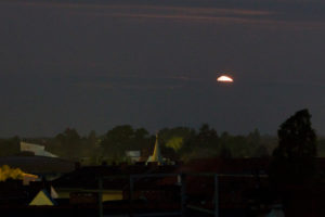 Setting moon with a golden handle, Berlin, looking west, dawn Setting moon with a golden handle, Berlin, looking west, dawn